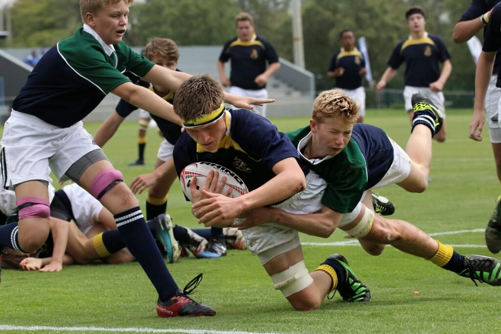 Rugby players in a competitive match showcasing teamwork and agility.